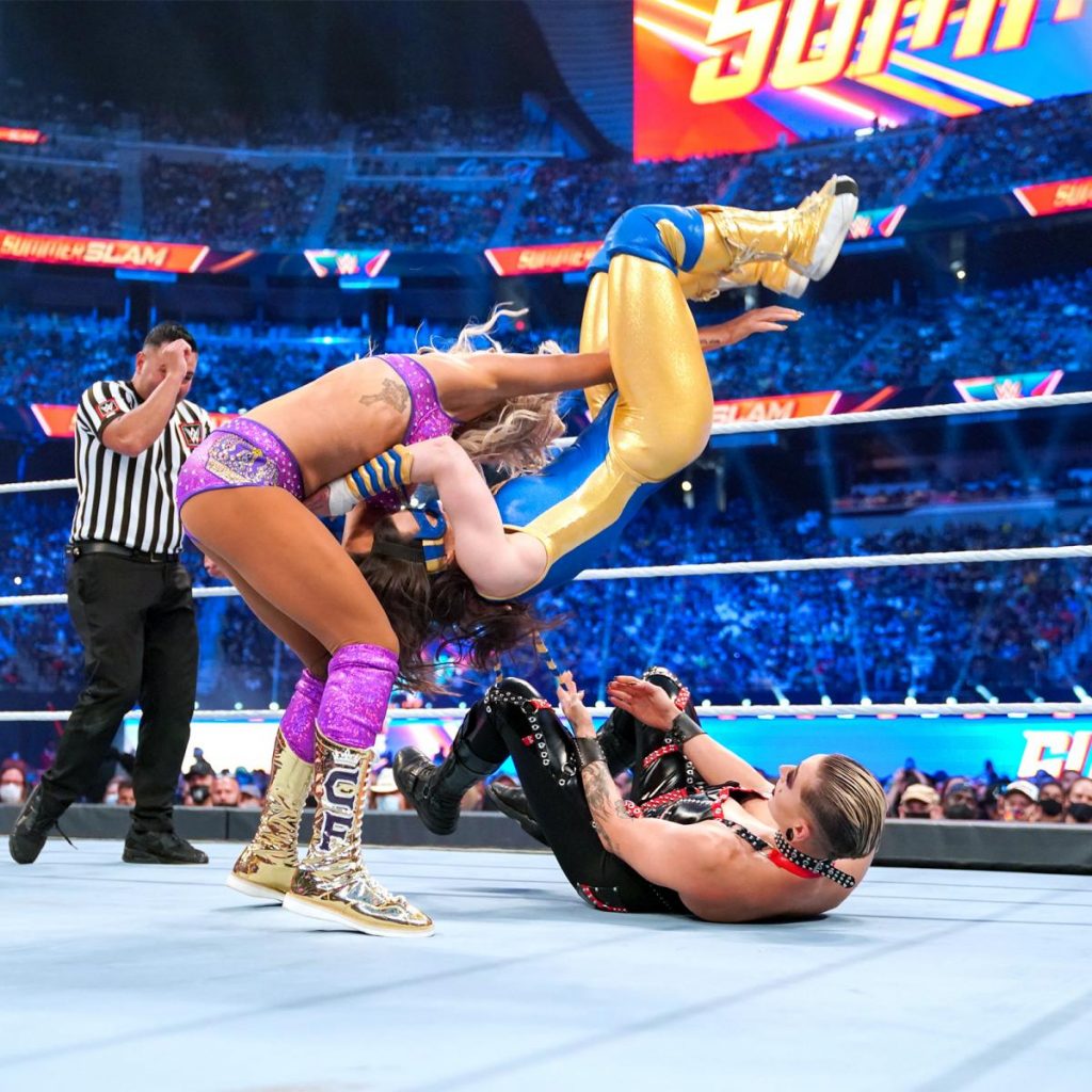 Charlotte Flair slams Nikki A.S.H. onto Rhea Ripley