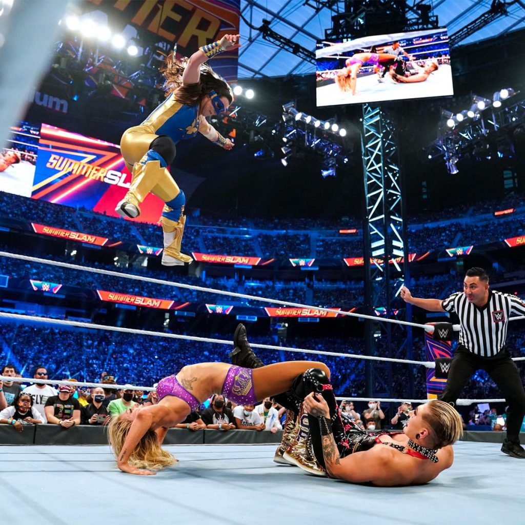 Nikki A.S.H launches herself off the top to break up Charlotte Flair's Figure Eight on Rhea Ripley