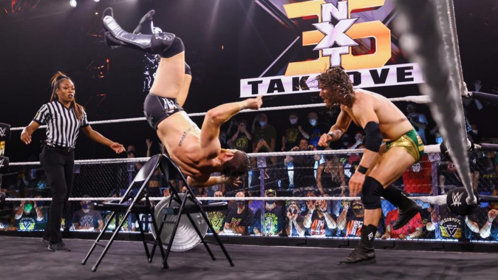 Adam Cole throws Kyle O'Reilly onto chairs