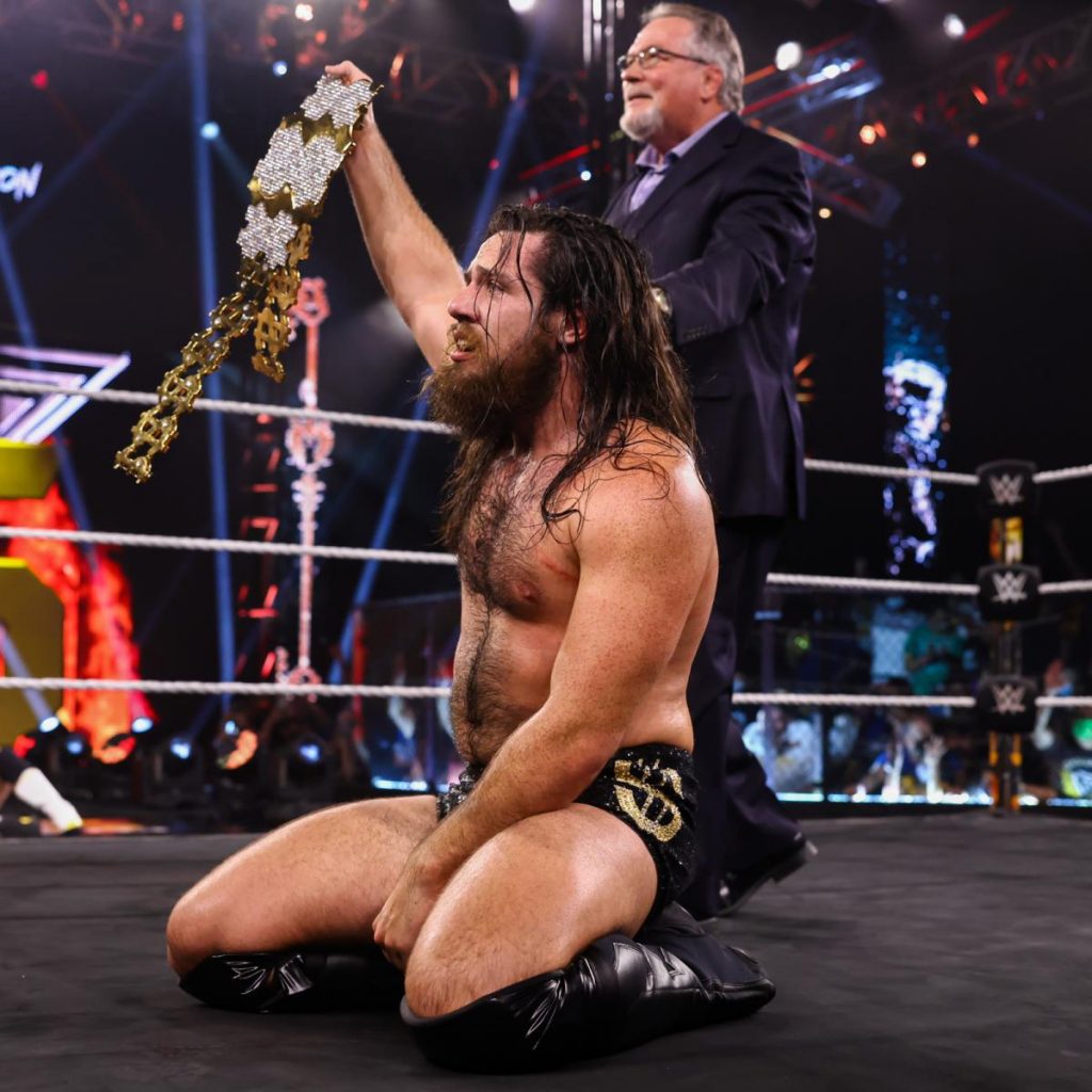 Cameron Grimes and Ted Dibiase celebrate