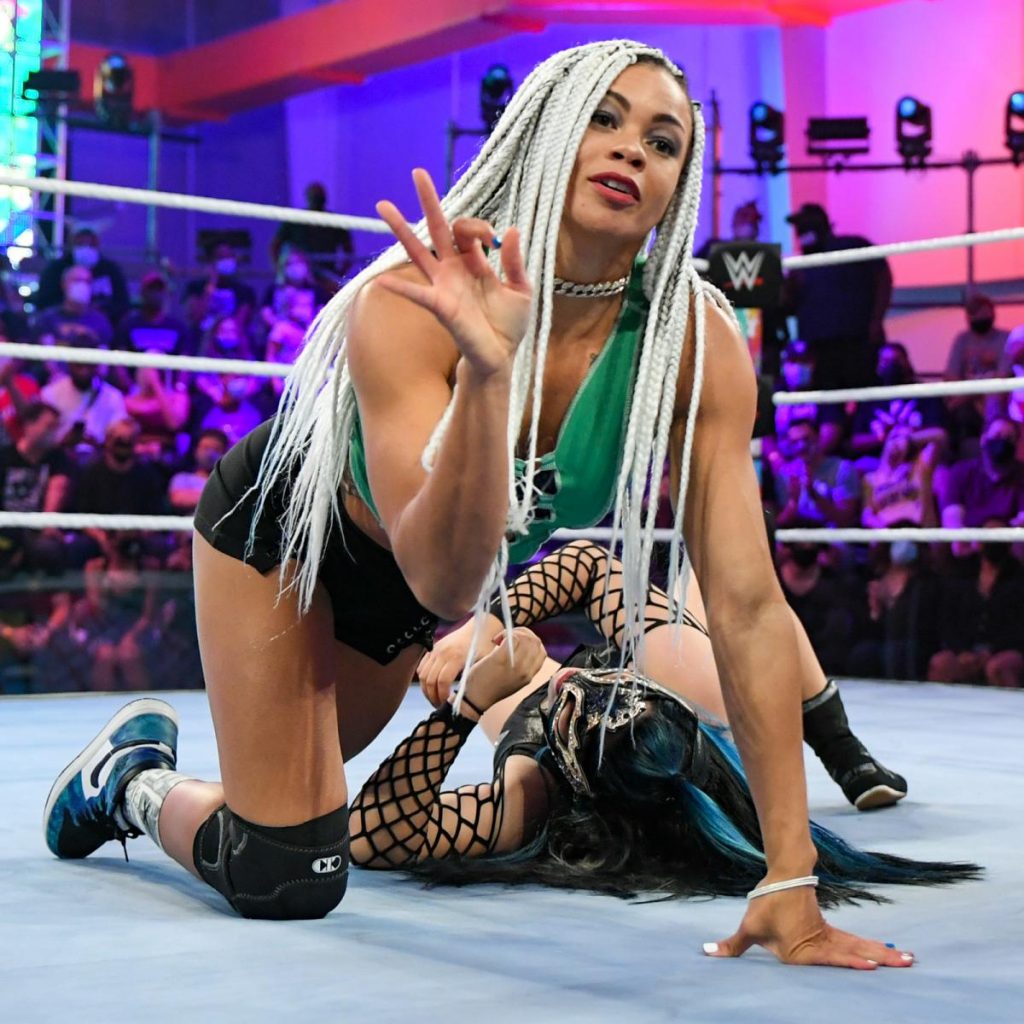 B-Fab poses over Katrina Cortez