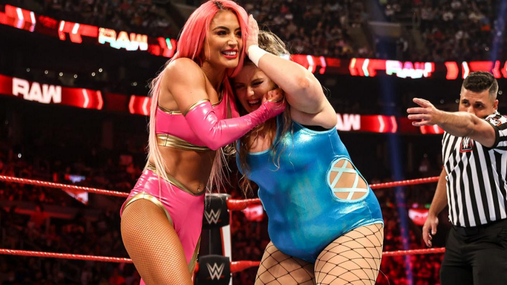 Eva Marie with Doudrop in the world's weakest headlock