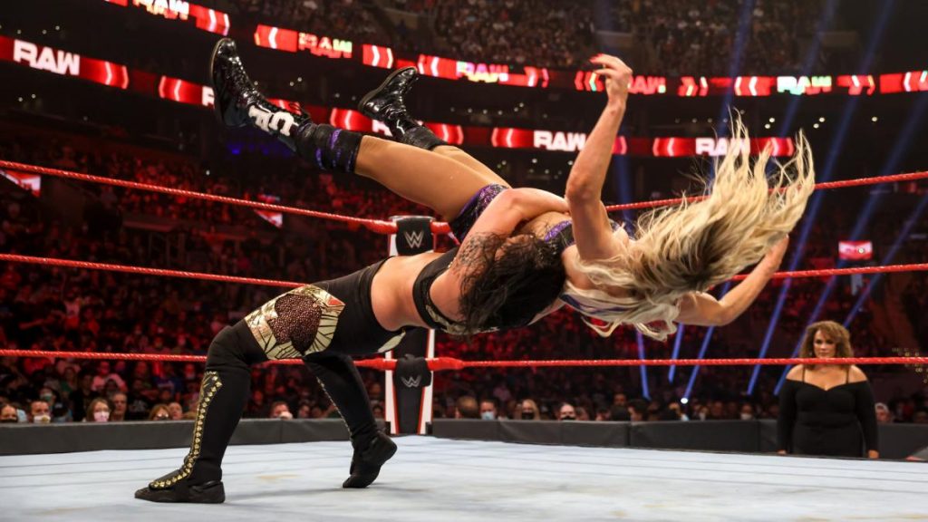 Shayna Baszler suplexes Charlotte Flair
