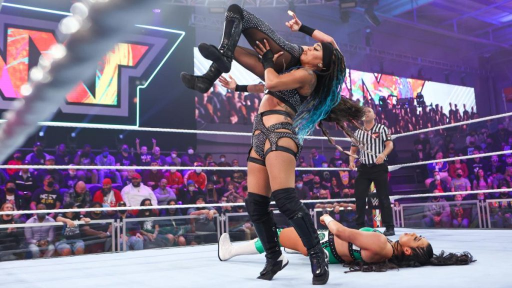 Kayden Carter assists Kacy Catanzaro onto Indi Hartwell