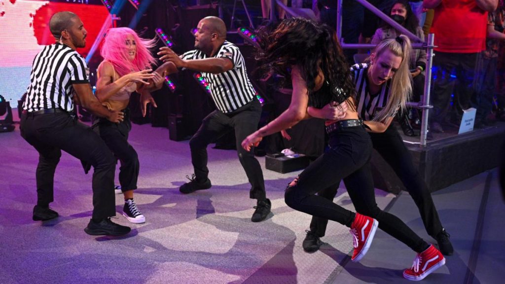 Officials hold Dakota Kai and Cora Jade apart