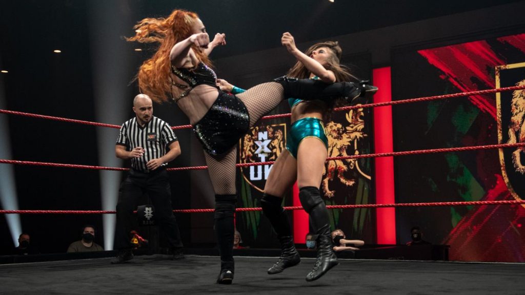 Isla Dawn kicks Angel Hayze in the head