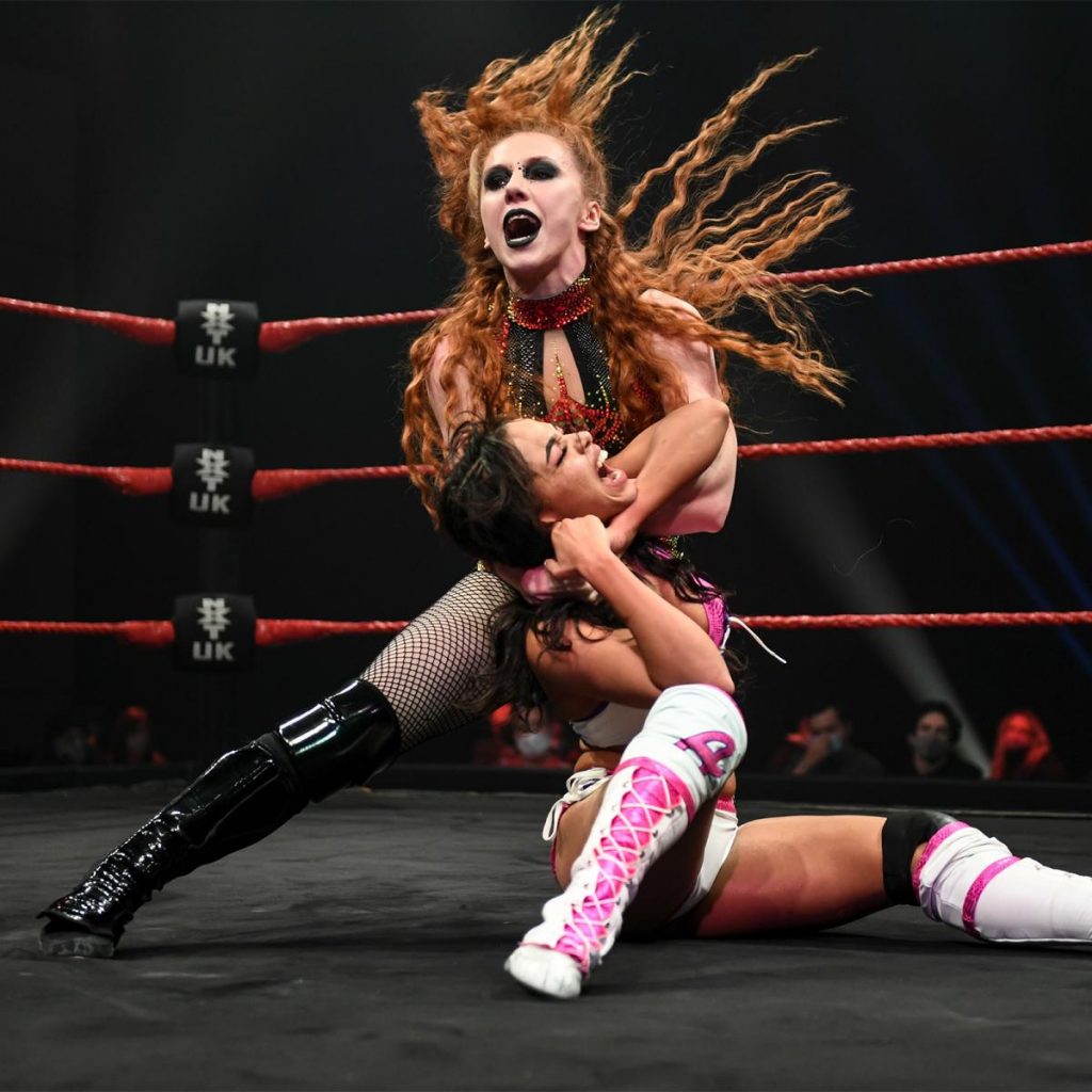 Isla Dawn with Aleah James in a headlock