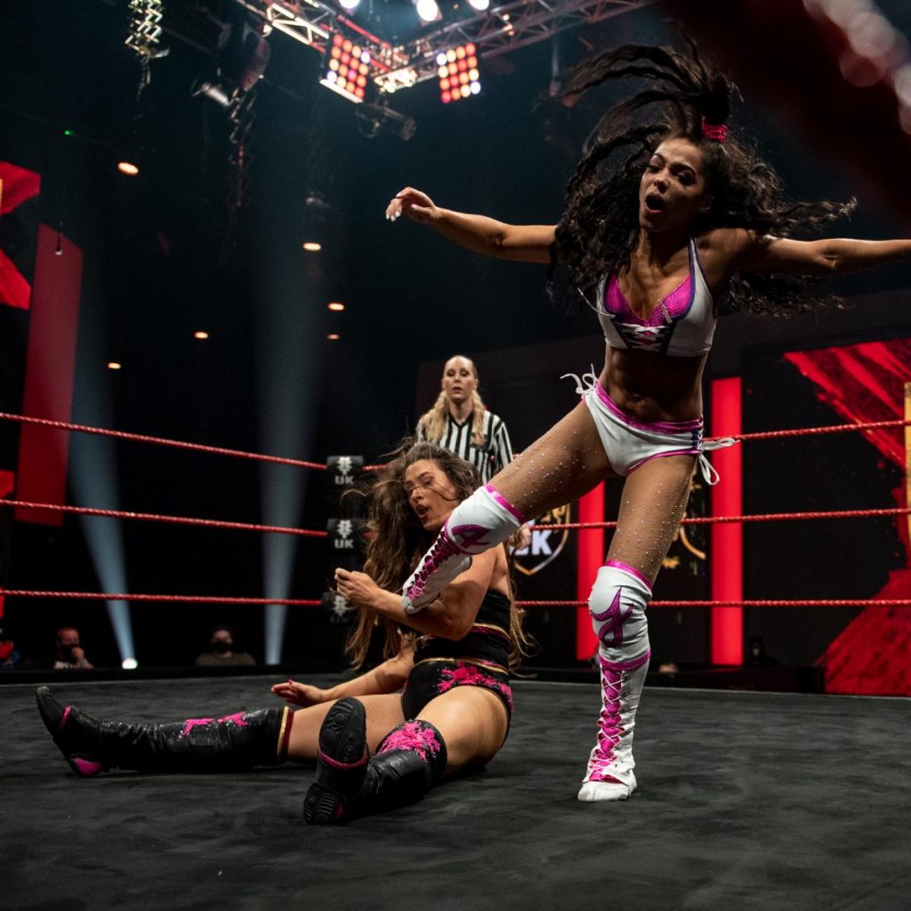 Nina Samuels grabs Aleah James' leg