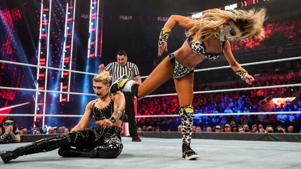 Carmella kicks Rhea Ripley in the head