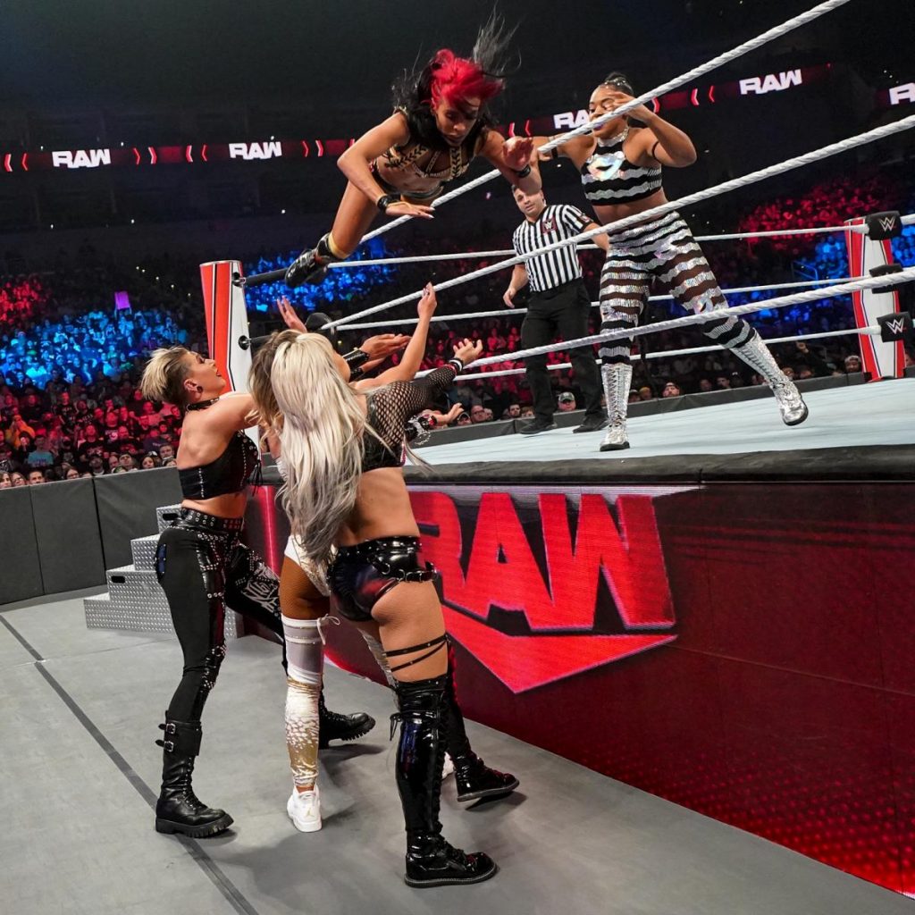 Bianca Belair throws Zelina Vega at Rhea Ripley, Liv Morgan, and Carmella