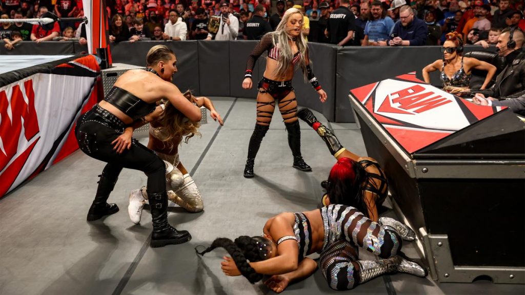Rhea Ripley, Liv Morgan, Carmella, Zelina Vega, and Bianca Belair brawl at ringside