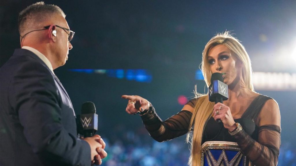 Michael Cole and Charlotte Flair