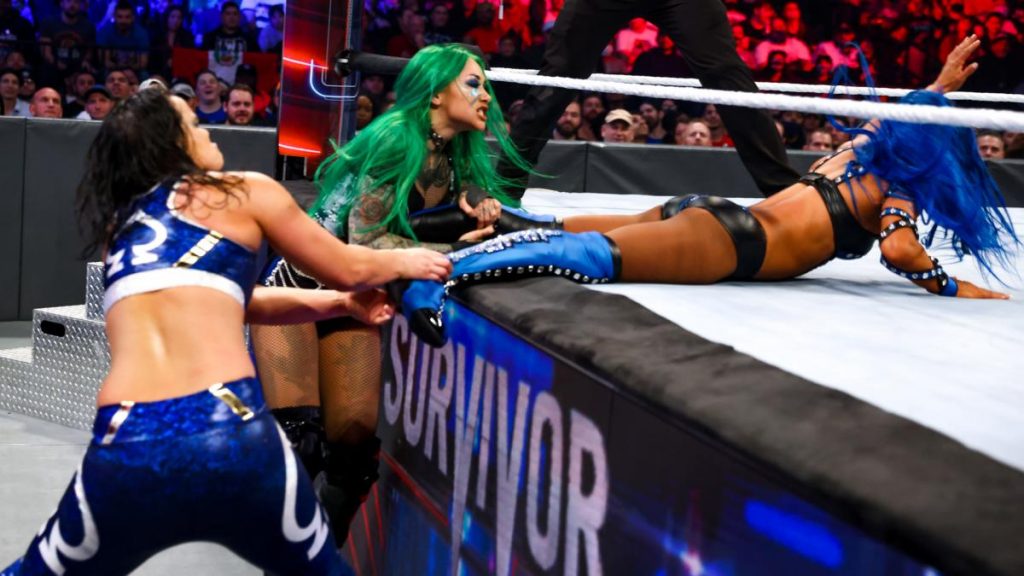 Shotzi and Shayna Baszler stop their Survivor Series teammate Sasha Banks re-entering the ring to break the count.