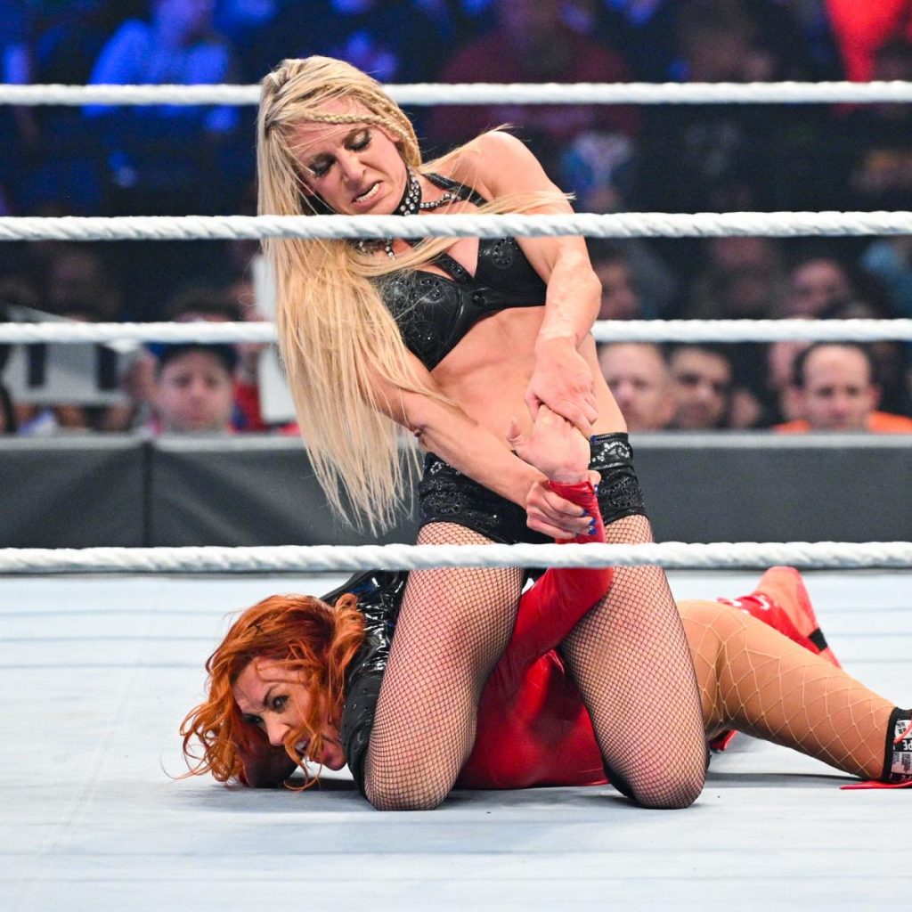 Charlotte Flair with Becky Lynch in a Dis-Arm-Her at Survivor Series