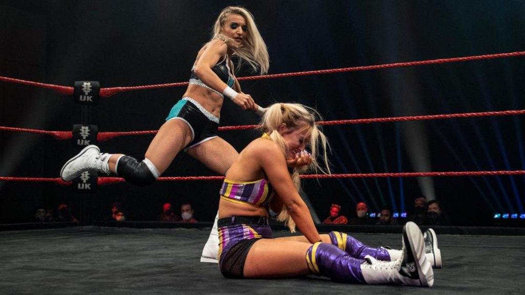 Xia Brookside kicks Myla Grace in the back