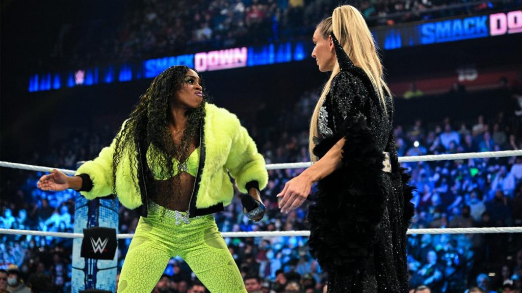 Naomi prepares to slap Charlotte Flair