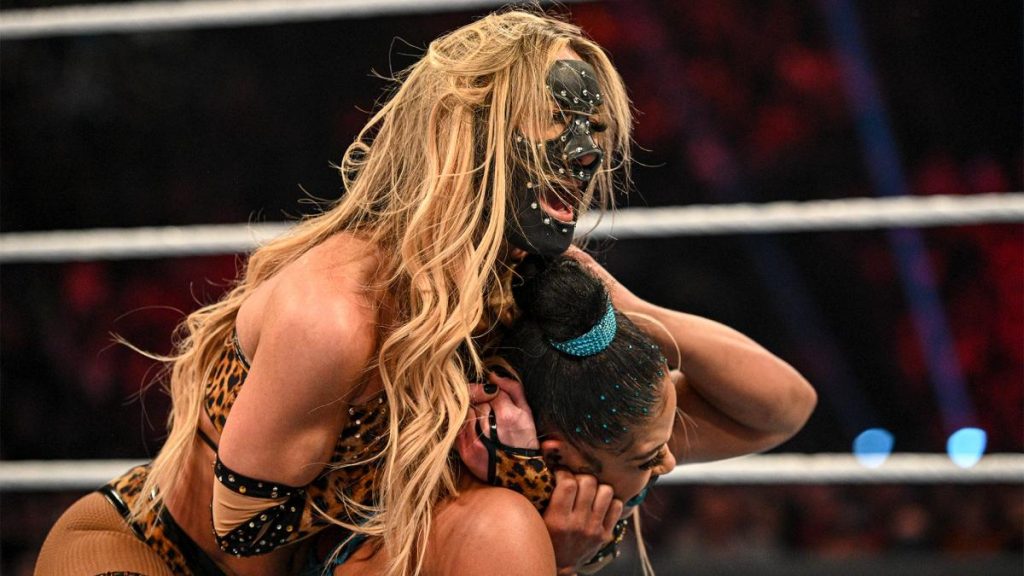 Carmella with Bianca Belair in a headlock