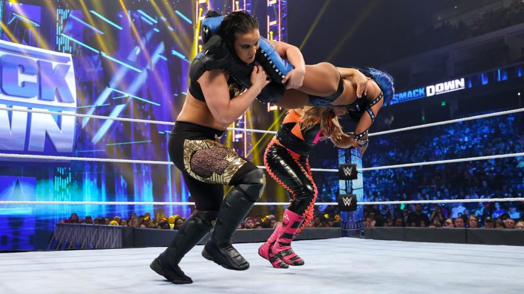 Sasha banks counters a double team to take down both opponents