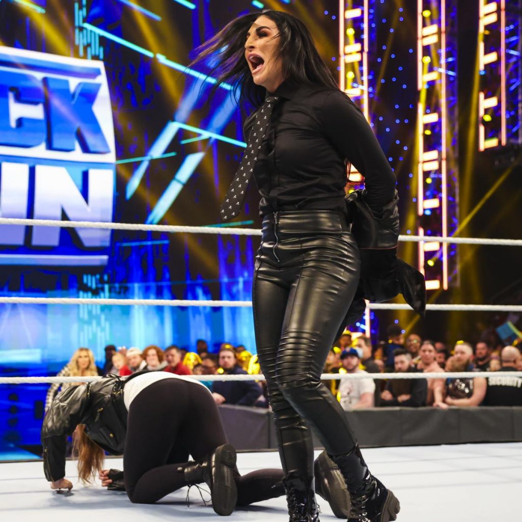 Sonya Deville luahgs after chop blocking Ronda Rousey